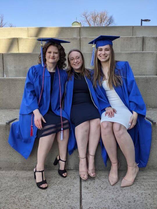 Carlyn Homann and her two friends in cap and gowns!